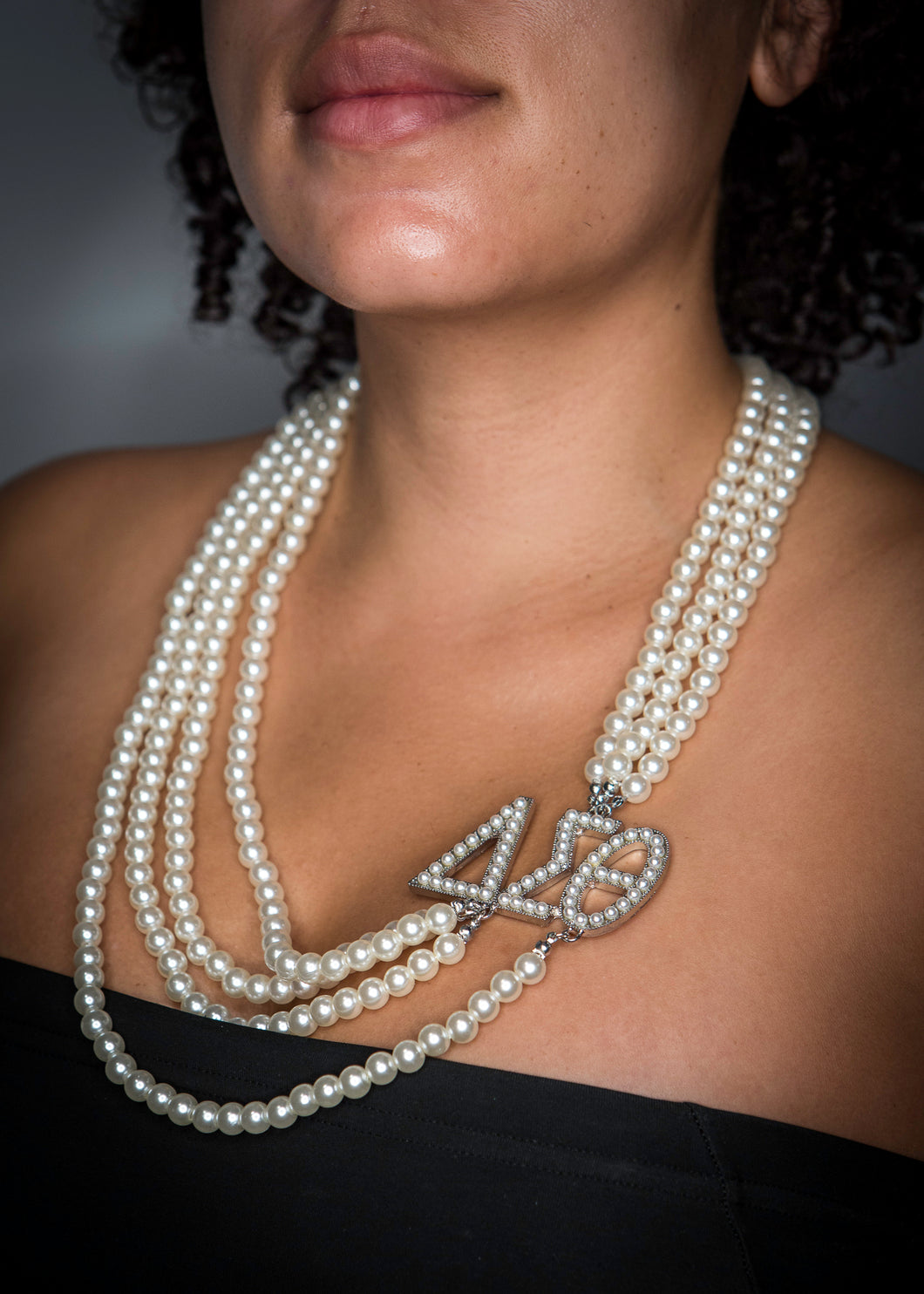 DST Pearl Four Strand w/Pearl Greek Letters